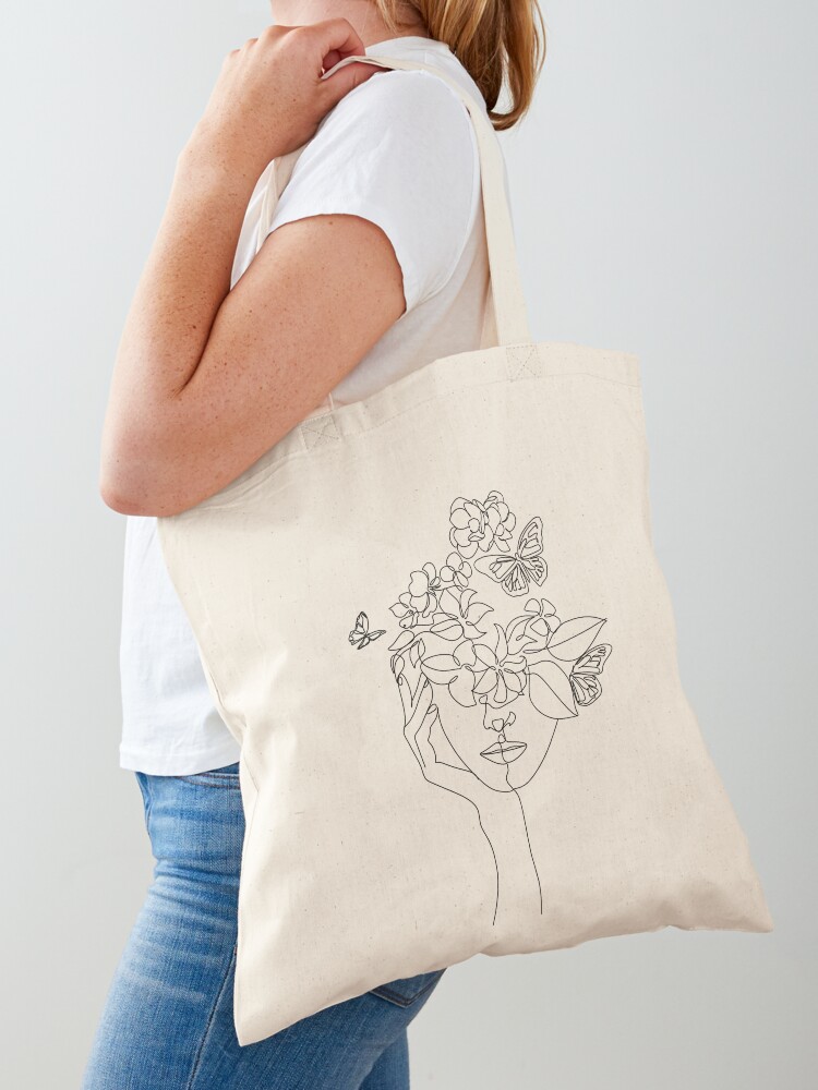 Women Fashion Vector - ภาพใบหน้าแบบนามธรรมพร้อมดอกไม้โดยใช้การวาดแบบเวกเตอร์เส้นเดียว ภาพบุคคลสไตล์มินิมอล ลายพิมพ์พฤกษศาสตร์ สัญลักษณ์แห่งธรรมชาติของกระเป๋าโท้ท c